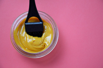 Barber shop set with hair dye, hairbrush, scissors, spray and brush on pink red background
