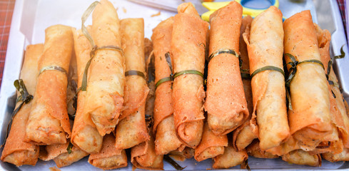 Fried Chinese traditional Spring rolls in street food market