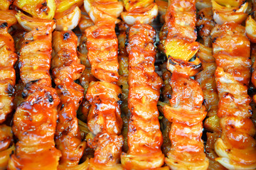 Barbecue grilled assorted sweet savory delicious with meat pork vegetables and fruit on grill BBQ.