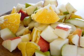 orange pear and apple prepared for a fresh and nutritious salad