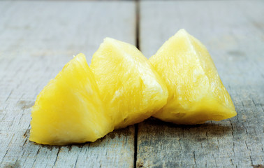 Pineapple slices on wooden.