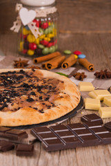 Sweet chocolate pizza with cookies.