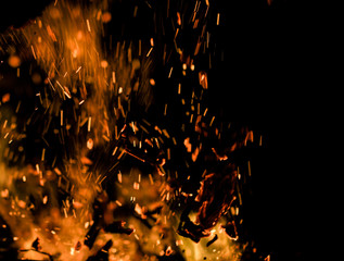 flame of fire with sparks on a black background