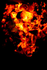 burning firewood on black background