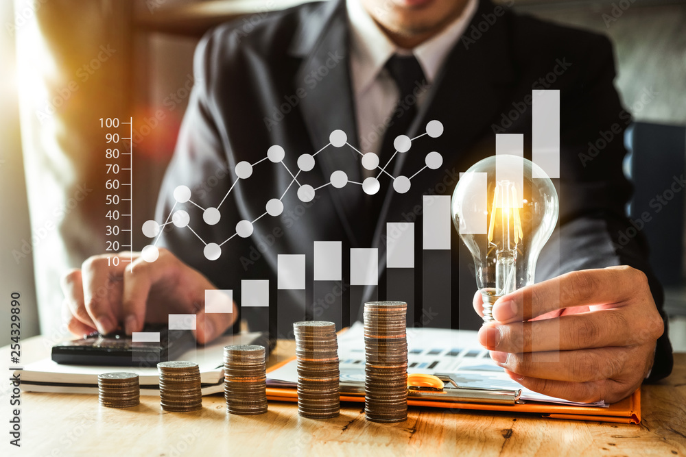 Poster business man hand holding lightbulb with using smartphone and calculator to calculate and money stac