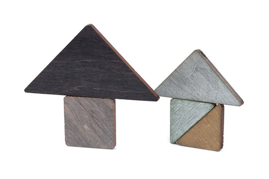 Wooden house toy blocks isolated white background, little wooden home. The concept of buying and selling real estate, rental housing. Affordable housing, investment and construction.