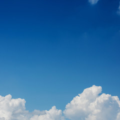 fluffy white cloud above clear blue sky background