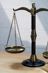Law scales on table background. Symbol of justice