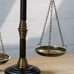 Law scales on table background. Symbol of justice