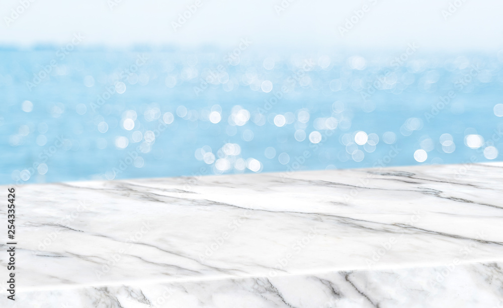 Aufkleber empty glossy white marble table top with blur sky and sea boekh background,banner mock up template f