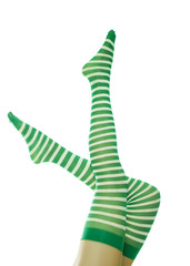 Sexy lady legs in green striped stockings. Leprechaun girl, isolated on white, side view