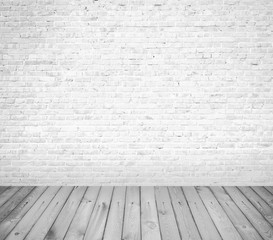 Grunge white brick wall with wooden floor