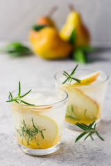 Summer drinks, rosemary pear cocktails. Selective focus, space for text.