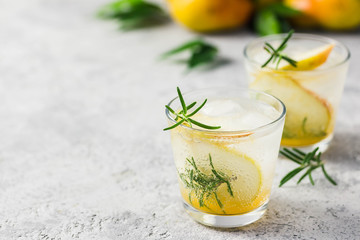 Refreshing drinks, rosemary pear champagne cocktail. Selective focus, space for text.