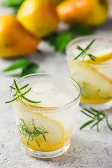 Pear rosemary spritzer. Selective focus, space for text.