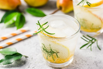 Pear rosemary spritzer. Selective focus, space for text.