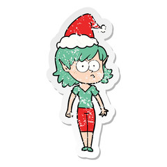 distressed sticker cartoon of a elf girl staring wearing santa hat