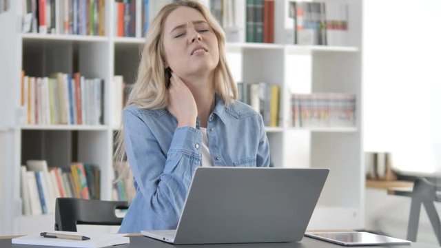 Tired Young Woman with Neck Pain at Work