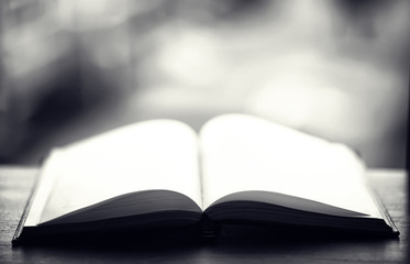 open book and a table black and white