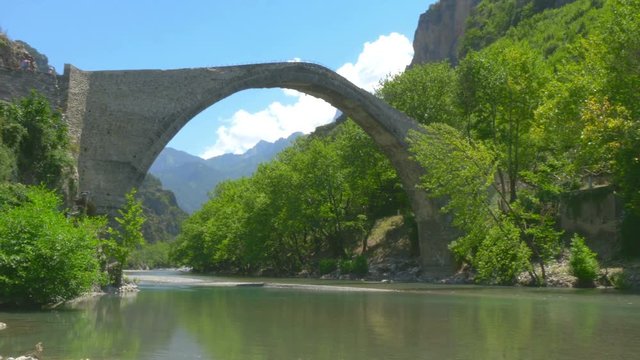 View of the old stone bridge Noutsos located in central Greece, Zagori, Europe. 4K UHD video