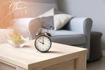 Alarm clock on table in room