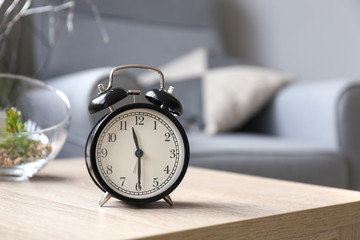 Alarm clock on table in room