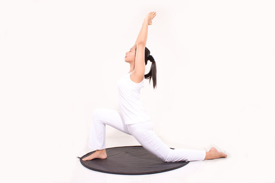 yoga pose women asian healthy. sporty fit asian woman practices yoga asana Virabhadrasana