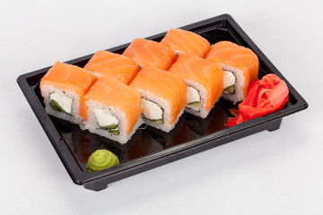 Japanese national popular cuisine. Sushi, rice and fish. Tasty, beautifully served food in a restaurant, cafe, with elements of the original design.