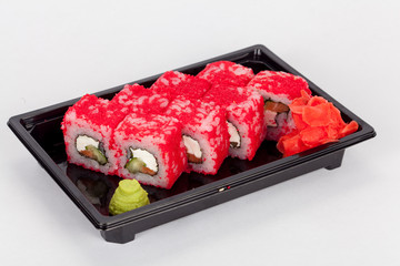 Japanese national popular cuisine. Sushi, rice and fish. Tasty, beautifully served food in a restaurant, cafe, with elements of the original design.