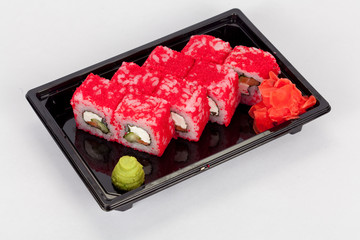 Japanese national popular cuisine. Sushi, rice and fish. Tasty, beautifully served food in a restaurant, cafe, with elements of the original design.