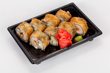 Japanese national popular cuisine. Sushi, rice and fish. Tasty, beautifully served food in a restaurant, cafe, with elements of the original design.