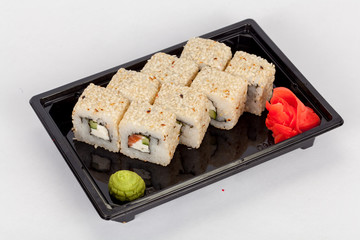 Japanese national popular cuisine. Sushi, rice and fish. Tasty, beautifully served food in a restaurant, cafe, with elements of the original design.