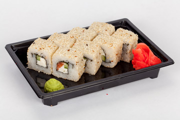 Japanese national popular cuisine. Sushi, rice and fish. Tasty, beautifully served food in a restaurant, cafe, with elements of the original design.