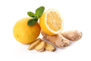 Fresh lemon with ginger and mint on white background