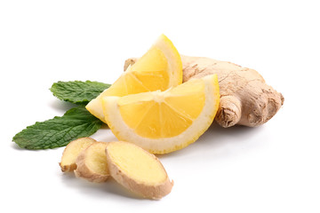 Fresh lemon with ginger and mint on white background