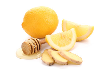 Fresh lemon with ginger and honey on white background