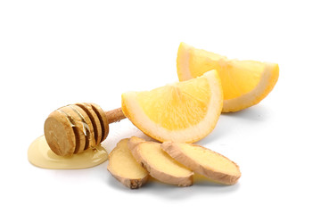 Fototapeta na wymiar Fresh lemon with ginger and honey on white background