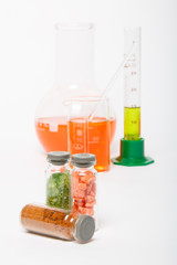 chemical reagents and minerals in clear glass bottles