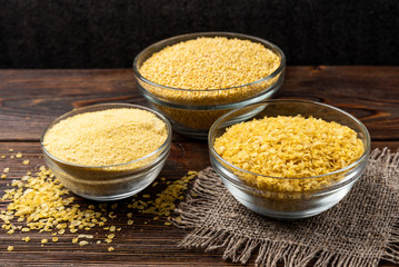 Millet on dark wooden background.