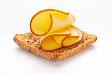 Sandwich with lettuce, cheese on white background.