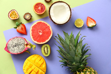 Assortment of exotic fruits on color background