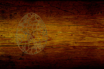 Obraz na płótnie Canvas easter egg with ornaments on the textured background