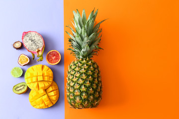 Assortment of exotic fruits on color background