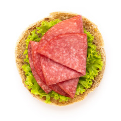Sandwich with salami sausage on white background.