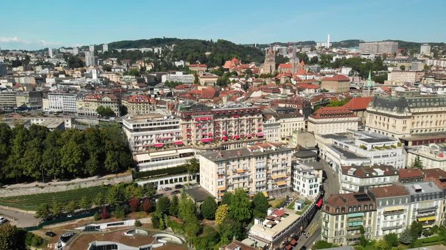 Aerial drone shot flying backwards showing Hotel Lausanne Palace in Lausanne Switzerland
