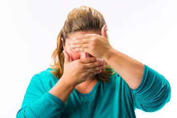 Fototapeta premium Shy fatty woman covering her face