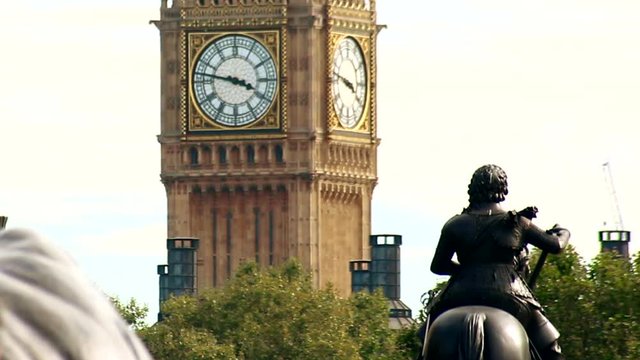 Close up of Big Ben, Parlament, with the statue of Charles I on horseback, located in Trafalgar Square, London in a sunny day.