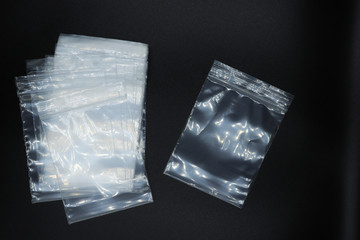 zip lock plastic bag isolated on black background.