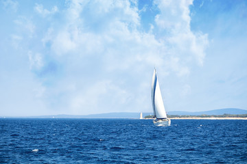Fototapeta na wymiar luxury big white sailing yachts at the sea