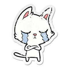 distressed sticker of a crying cartoon cat